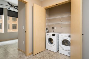 A laundry room with a washer and dryer in it.
